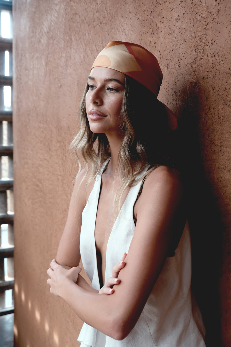 The Symbol Silk Scarf — styled for a minimalist travel wardrobe